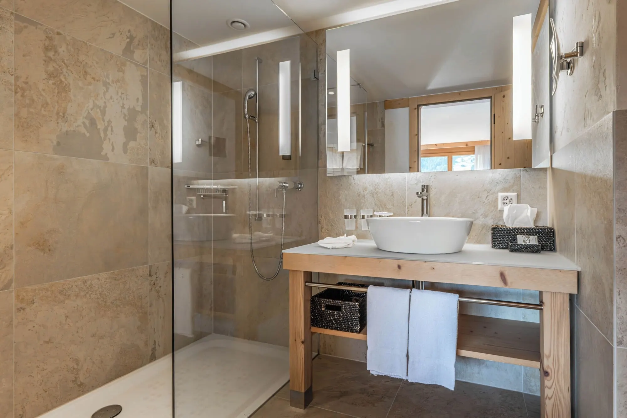 A bathroom with a walk-in shower