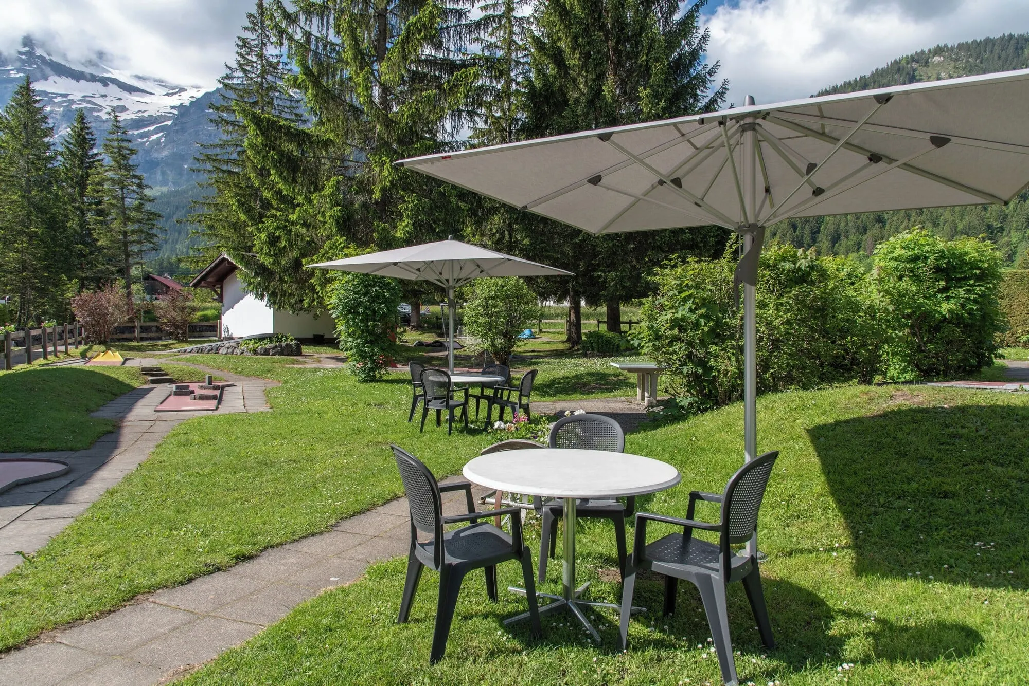 Garden tables under parasols