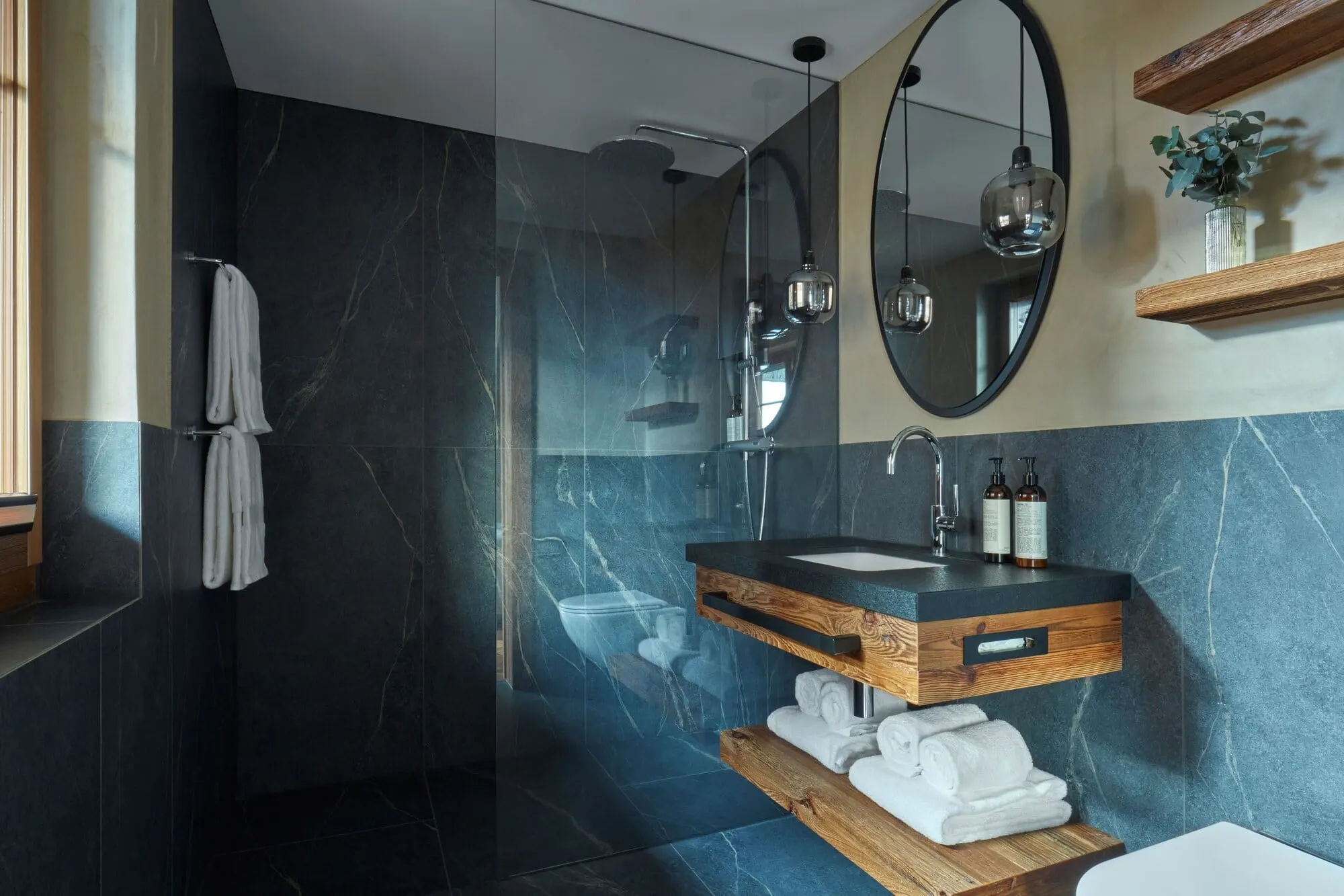 A bathroom with a walk-in shower