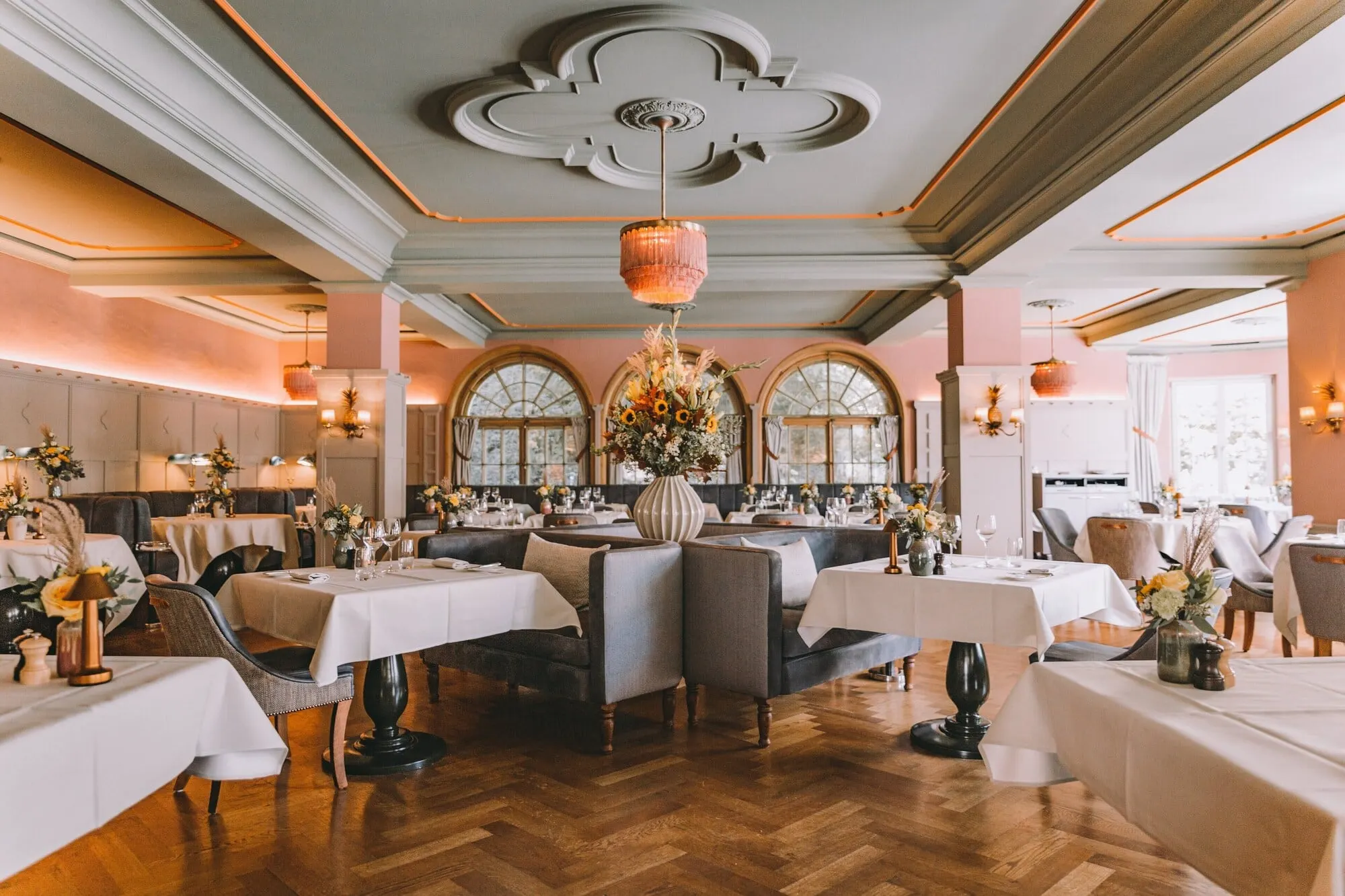 A dining room with arched windows