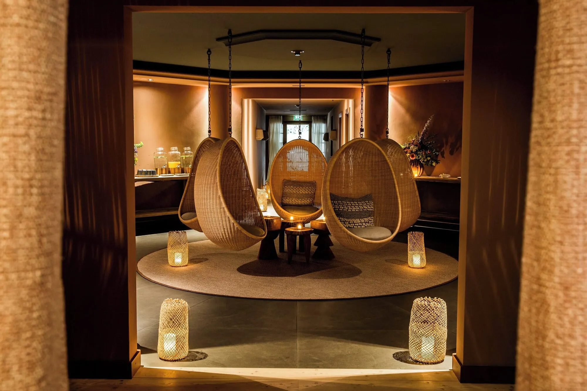 Hanging wicker chairs in the spa