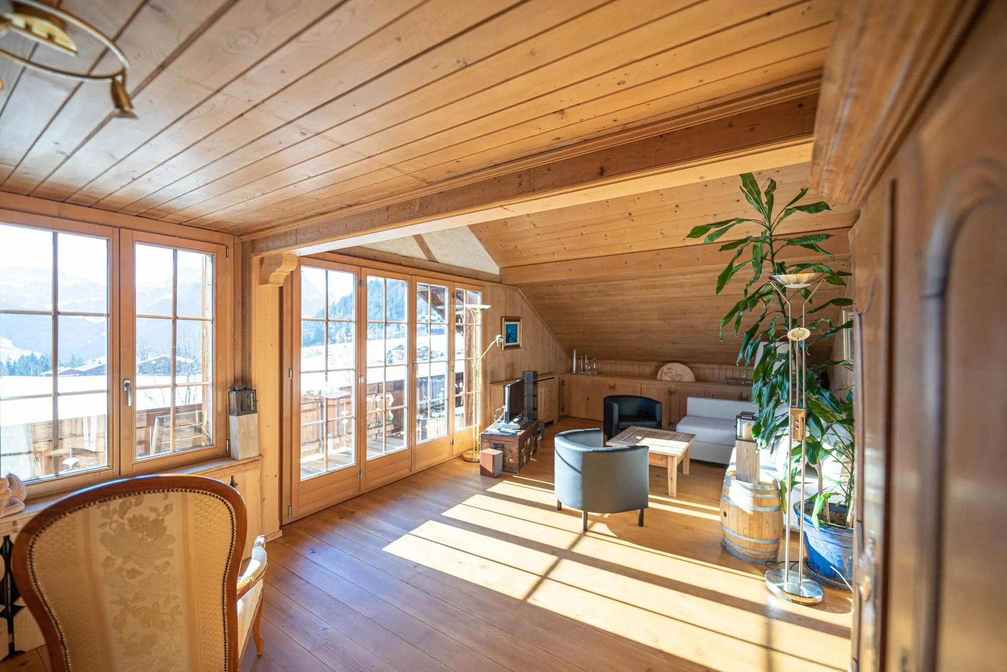A sunny room with balcony doors