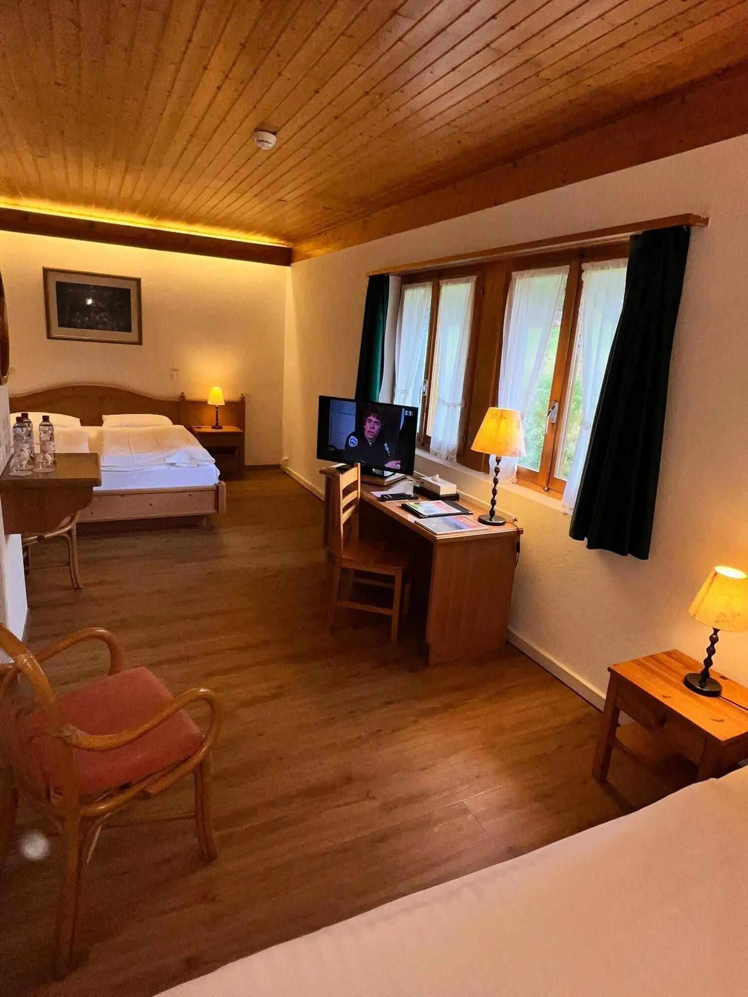 A double room with a desk