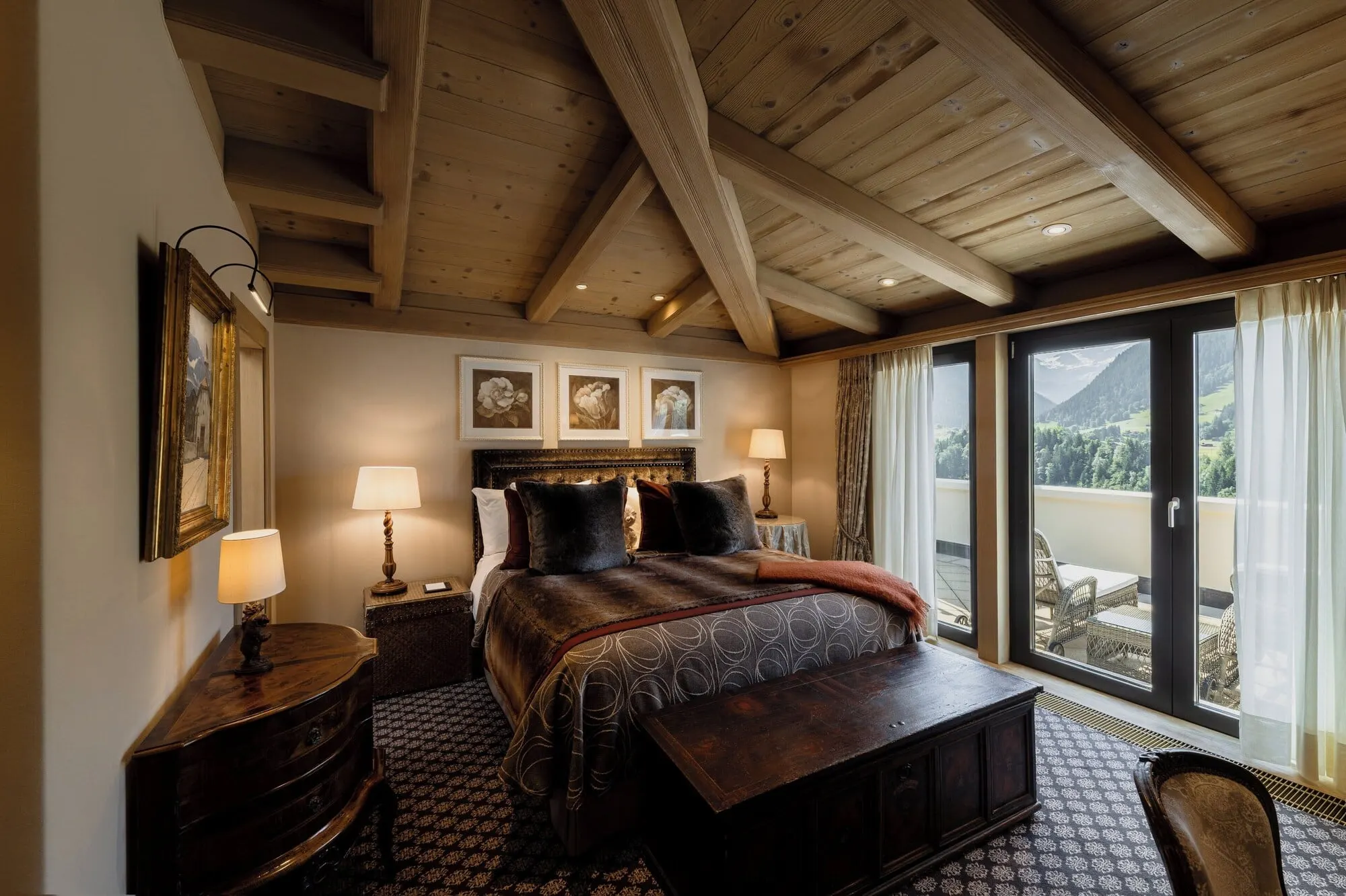 A bedroom under a beamed ceiling
