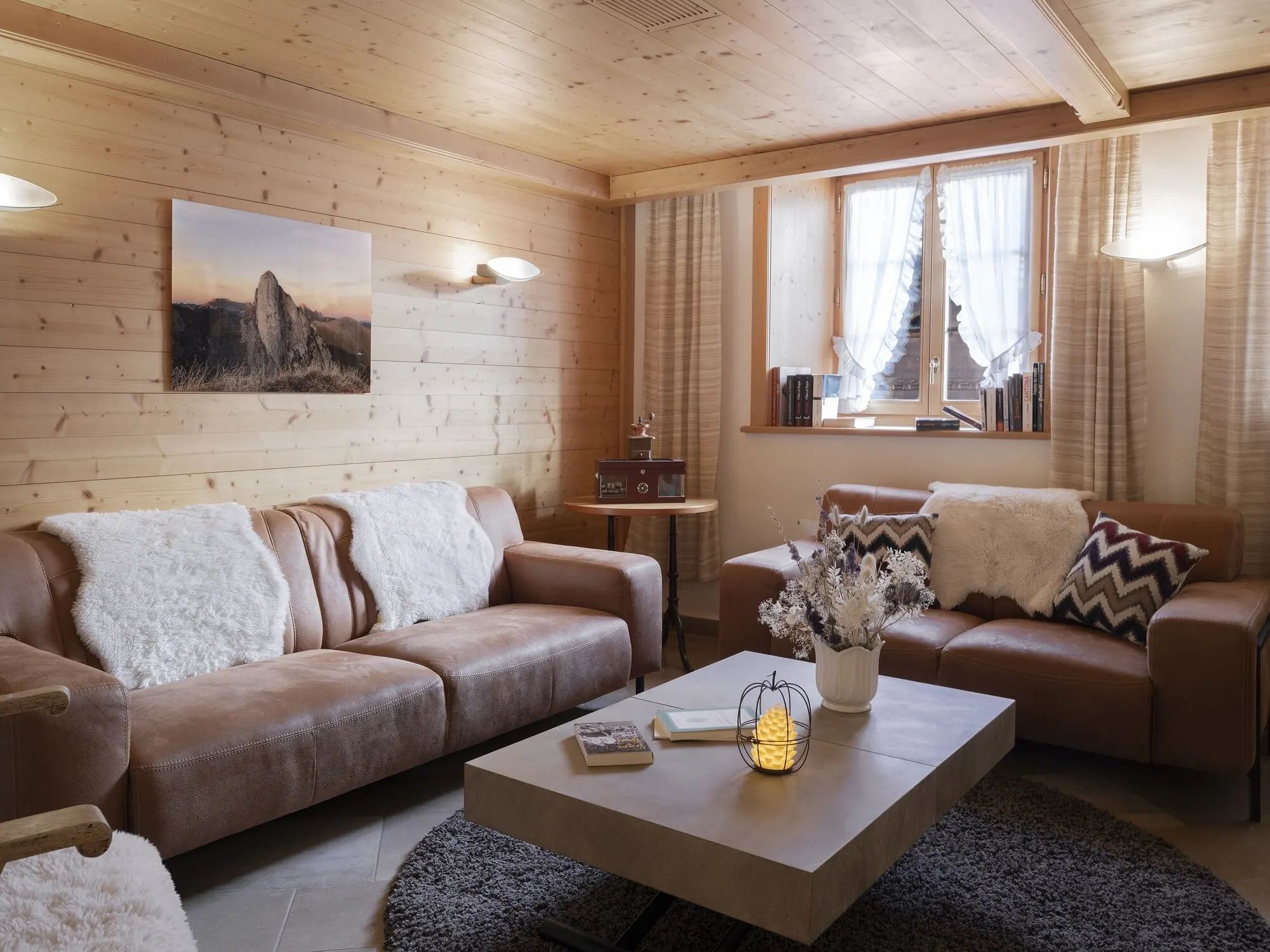 A sitting area with sofas