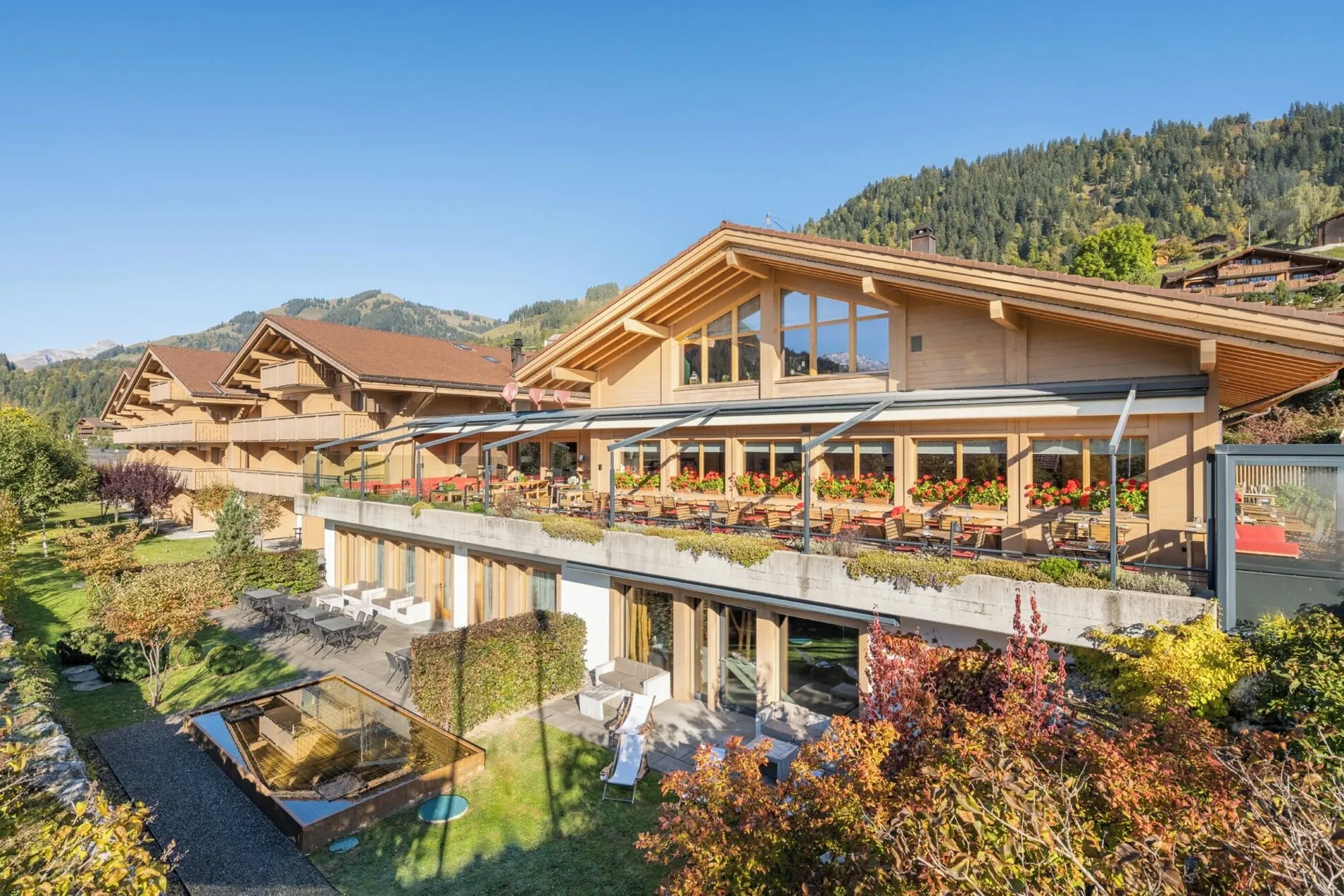 The hotel and its terrace in autumn sun
