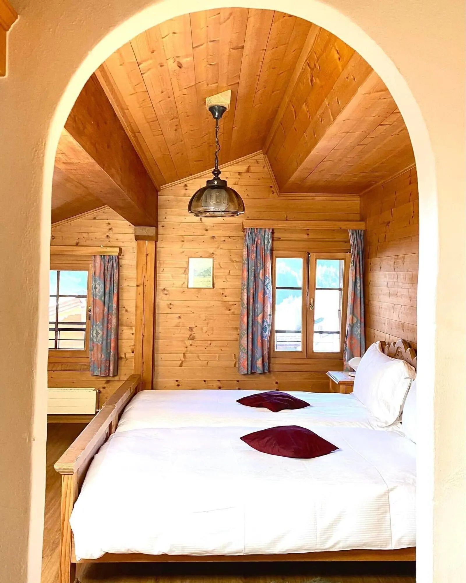 A pine-panelled room under the eaves