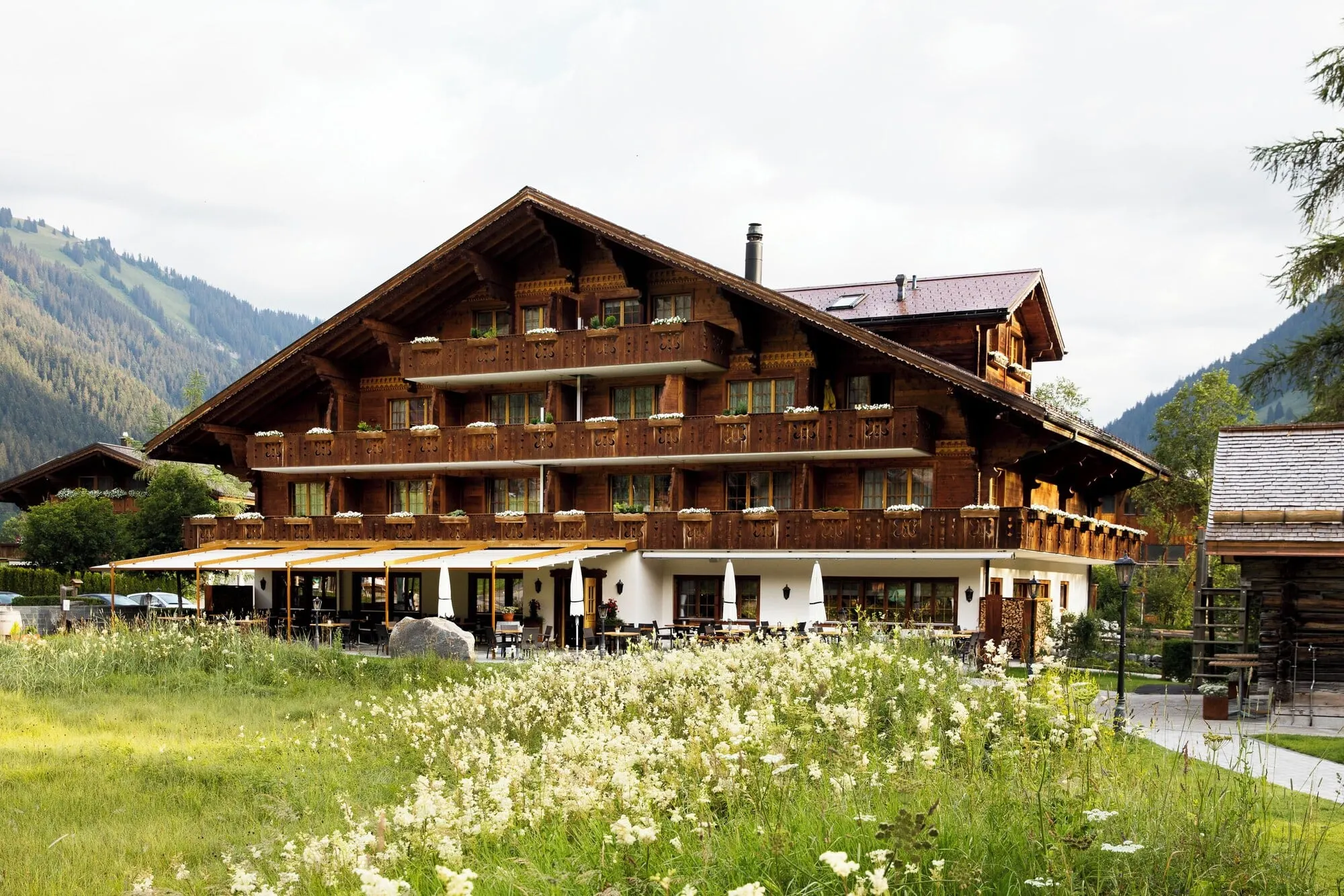 The hotel in a summer meadow at Lauenen