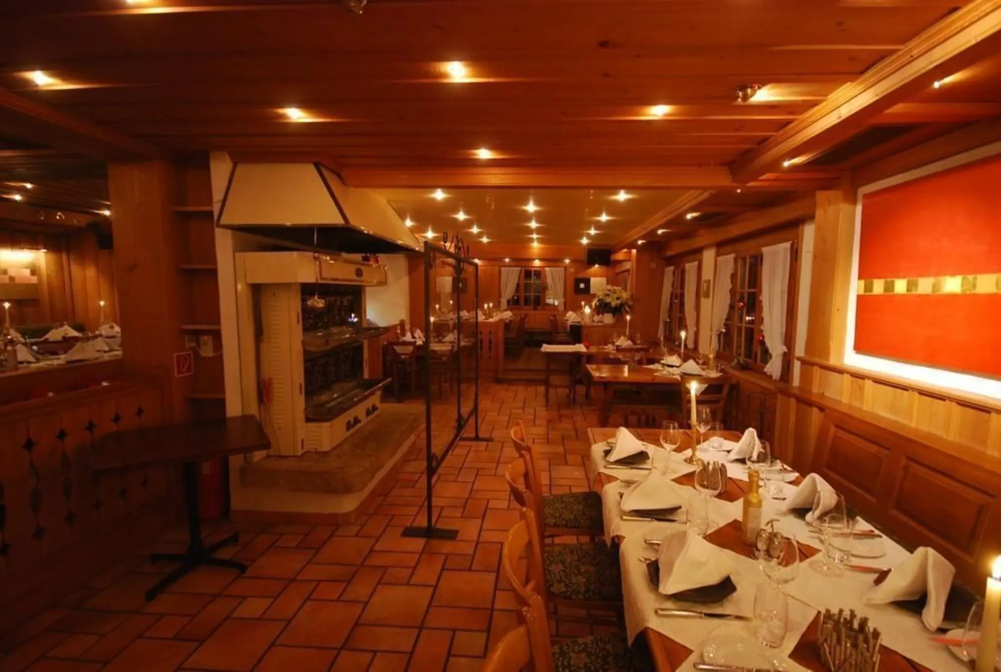 A wood-panelled restaurant set for dinner