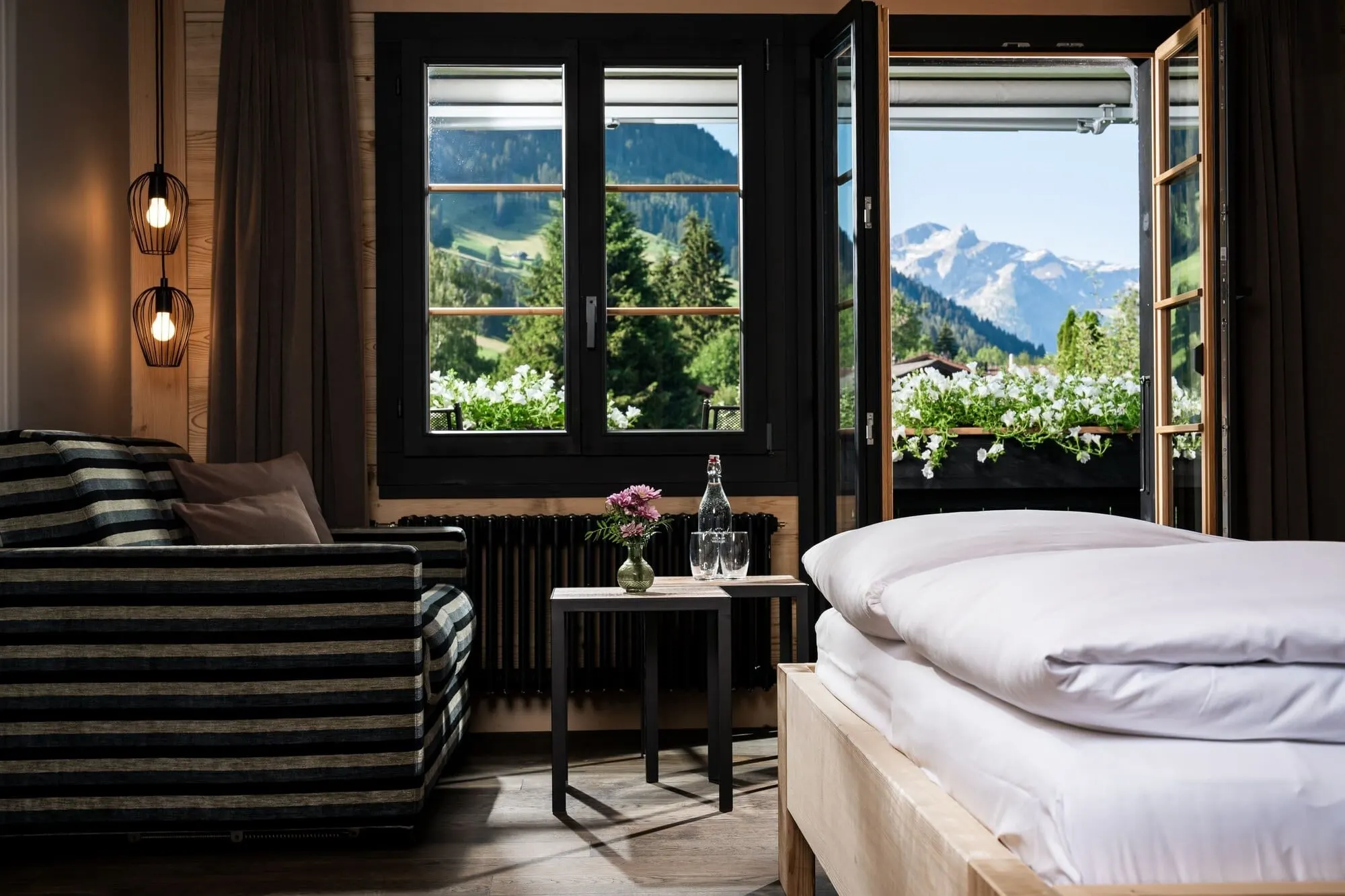 A bedroom with a view of the mountains