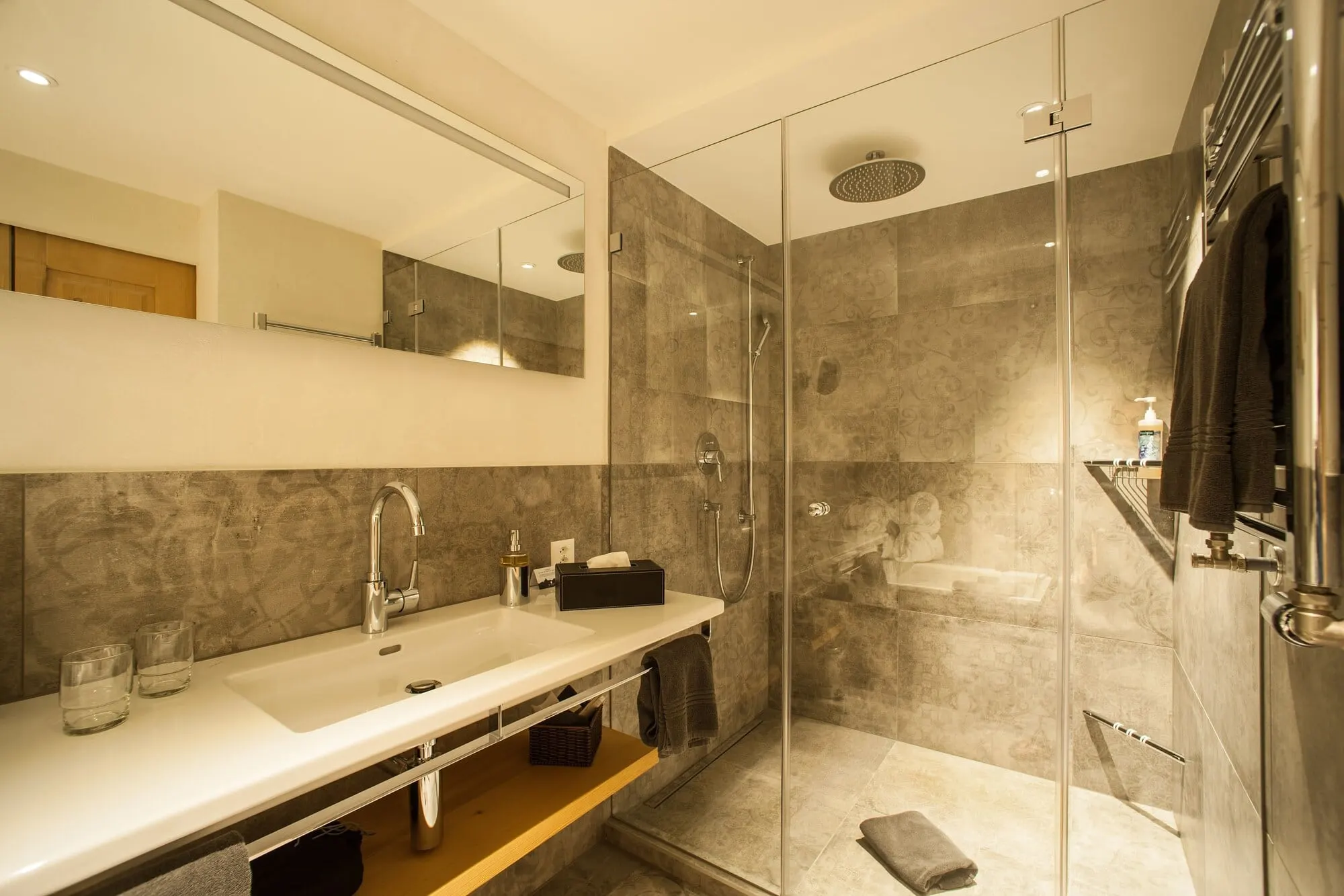A bathroom with a glass shower