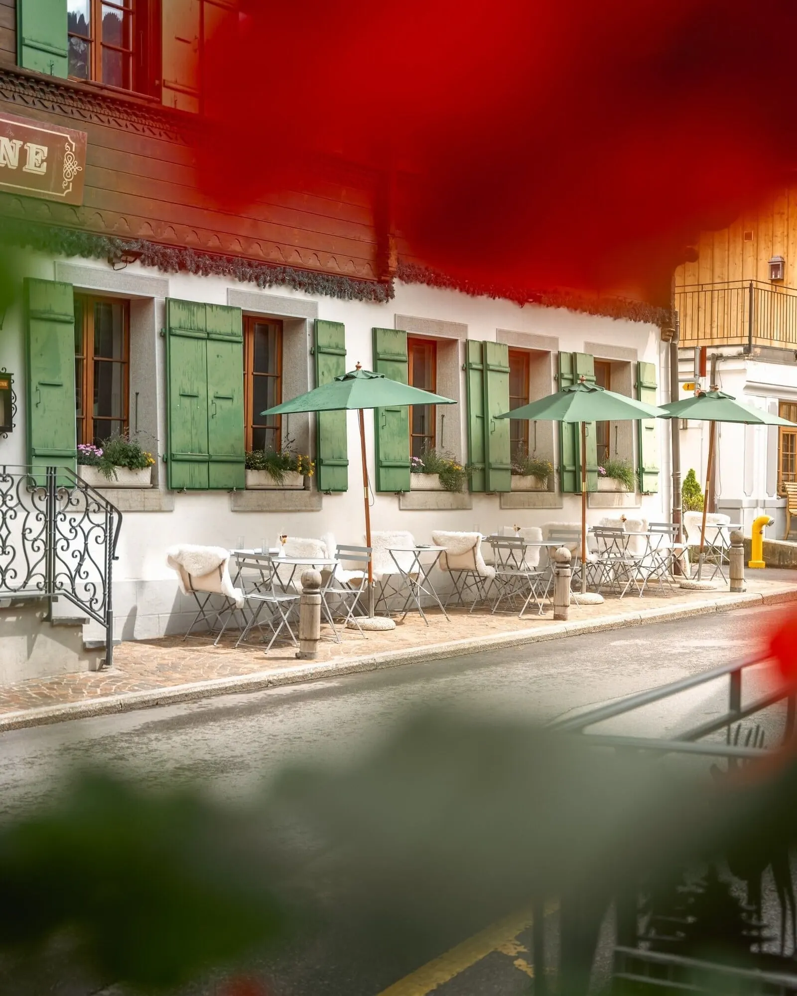 The street terrace under green parasols