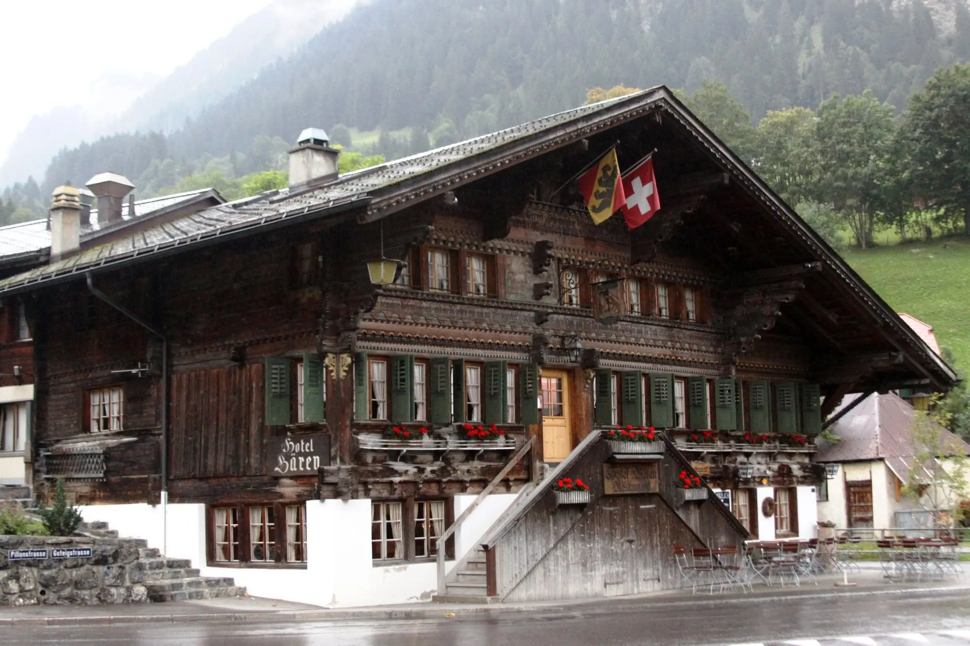 Carved wooden Hotel Bären on the village street in Gsteig