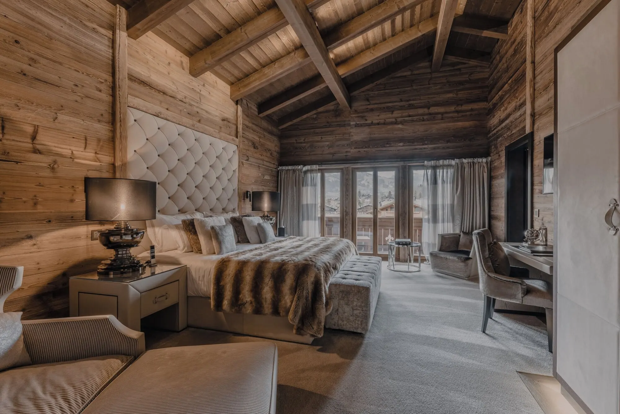 A bedroom under timber beams