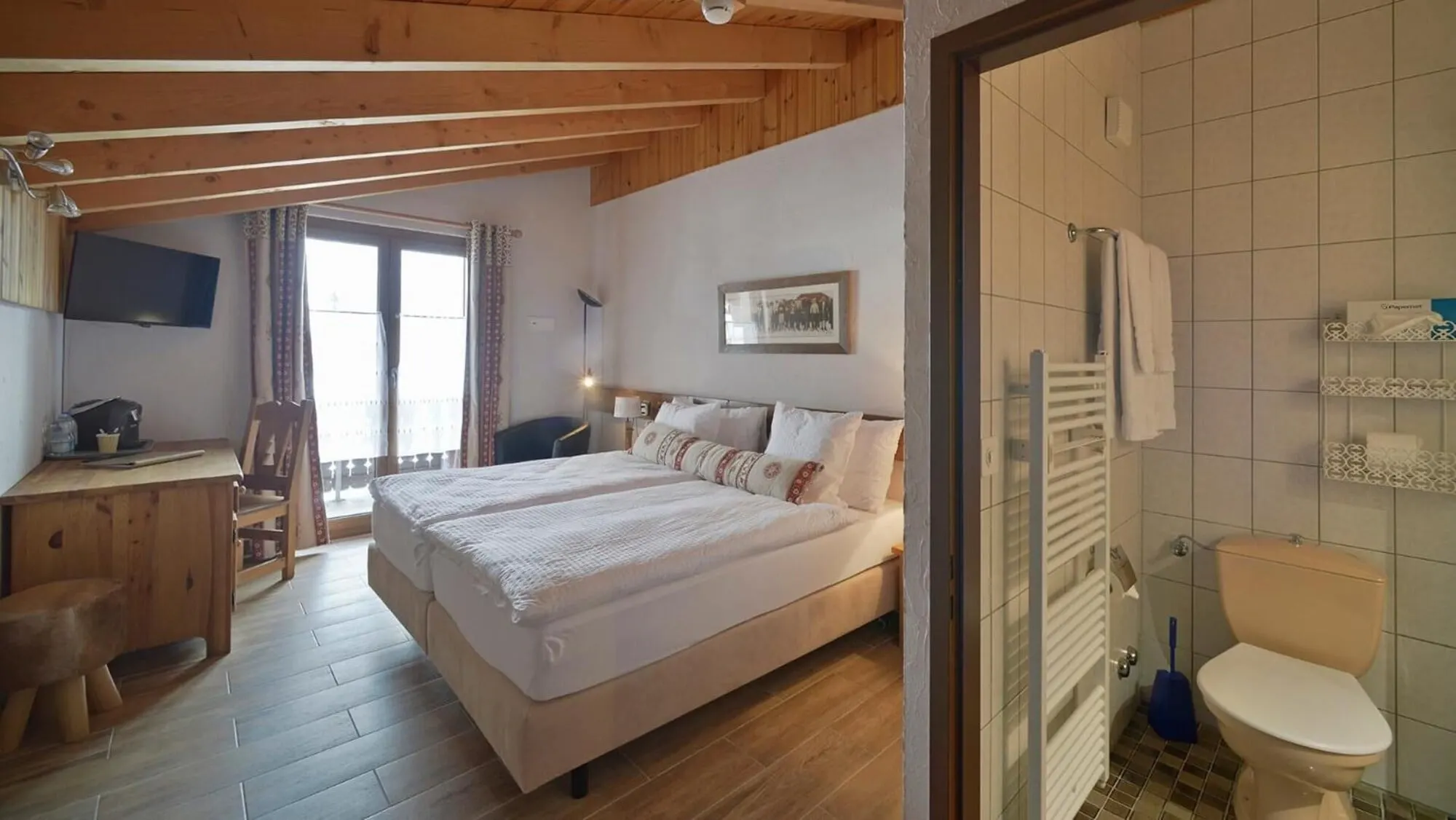 A double room with a balcony door