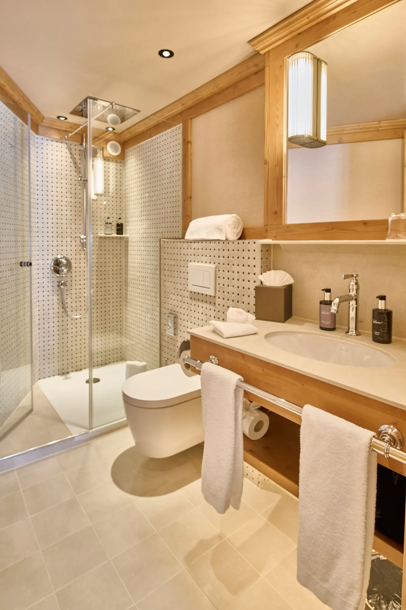 A bathroom with a walk-in shower