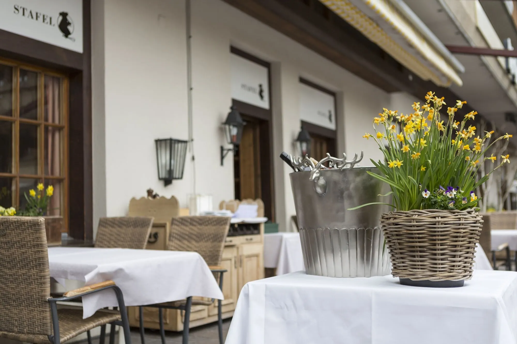 Outdoor tables in front of the hotel