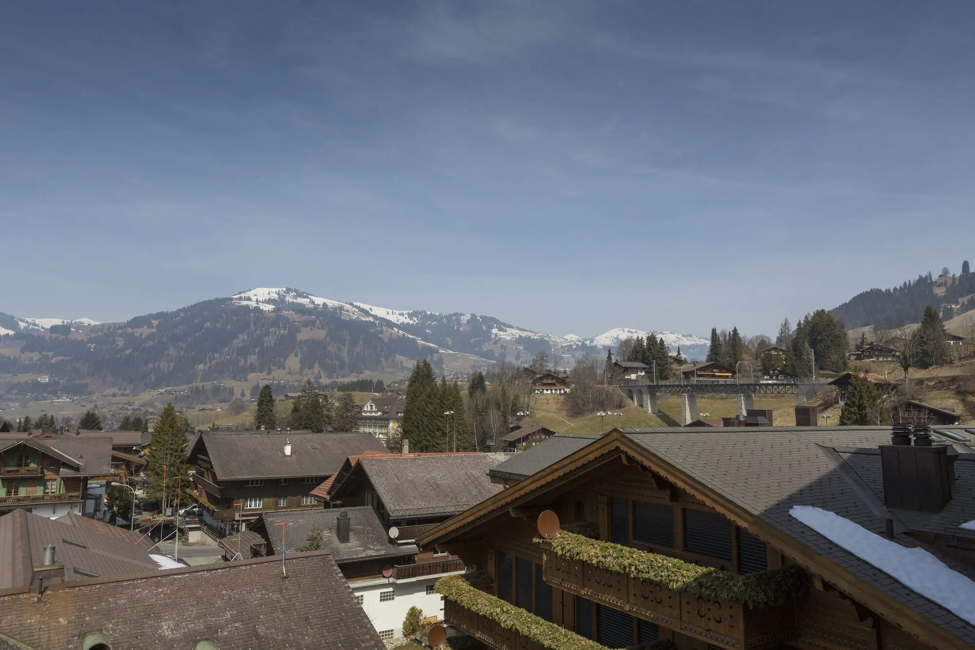 Rooftops of Gstaad and the mountains