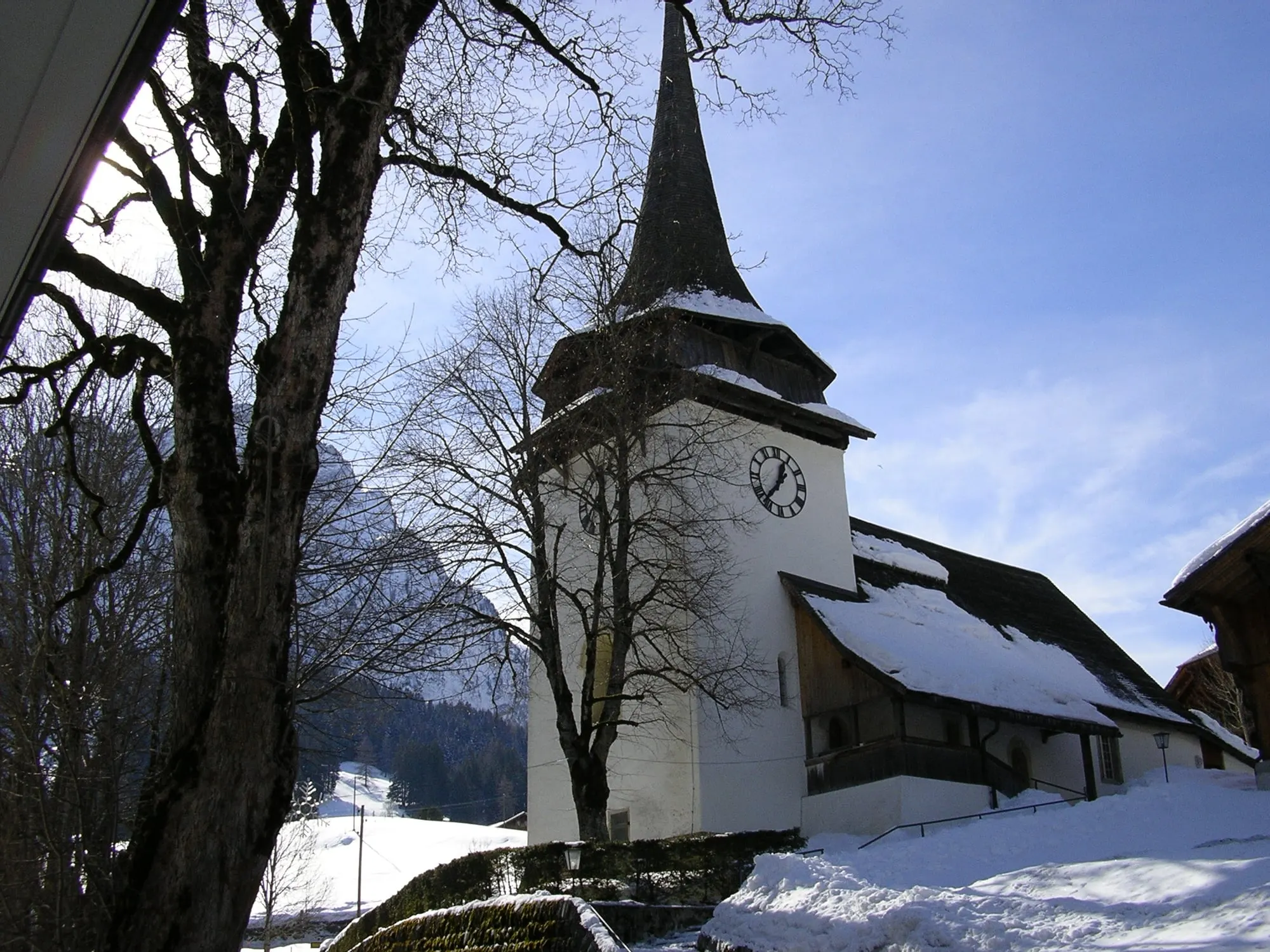 Gsteig church and its spire in winter