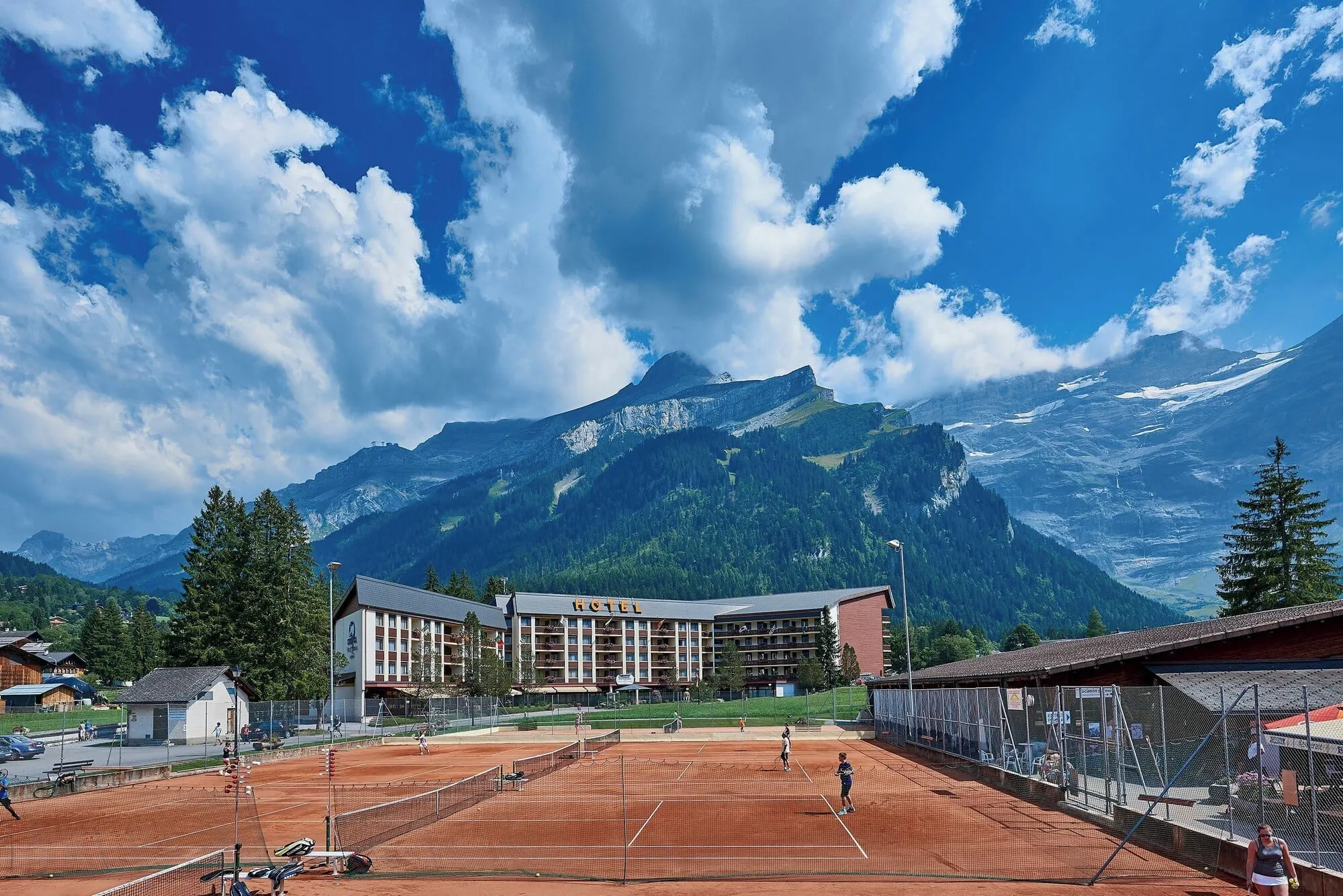 The hotel and tennis courts in summer