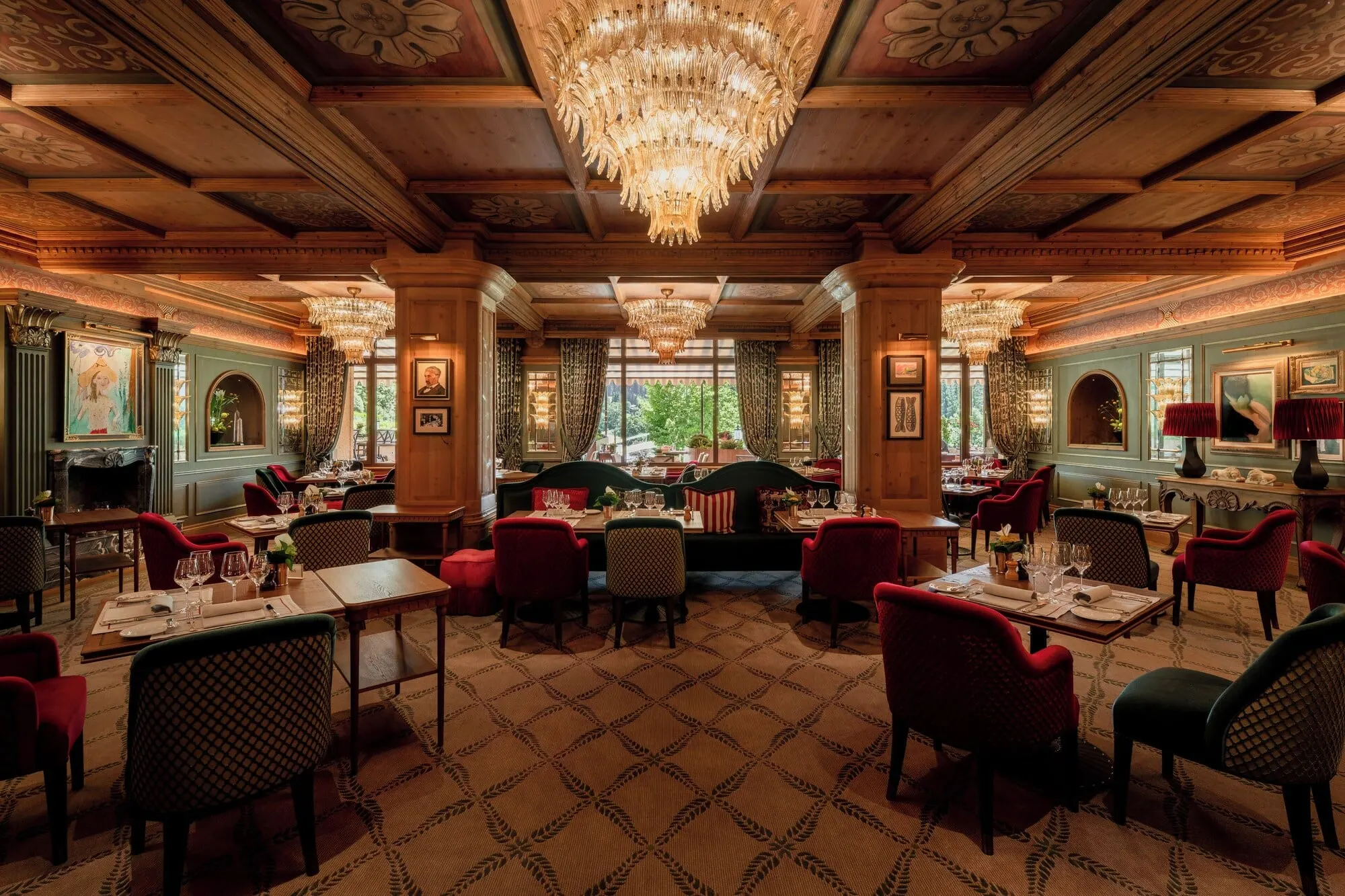 A panelled dining room with chandeliers