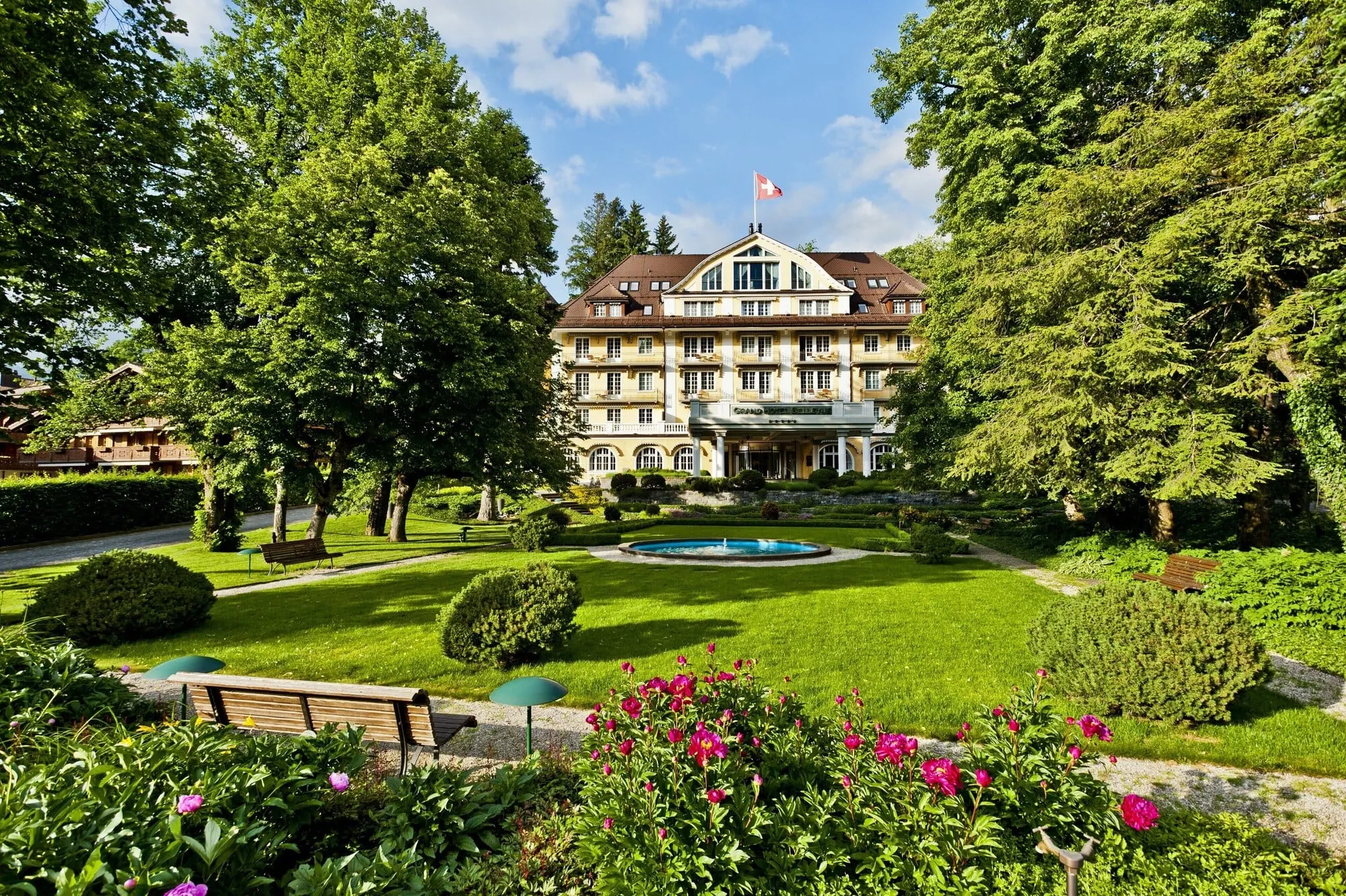 The hotel in its park in summer