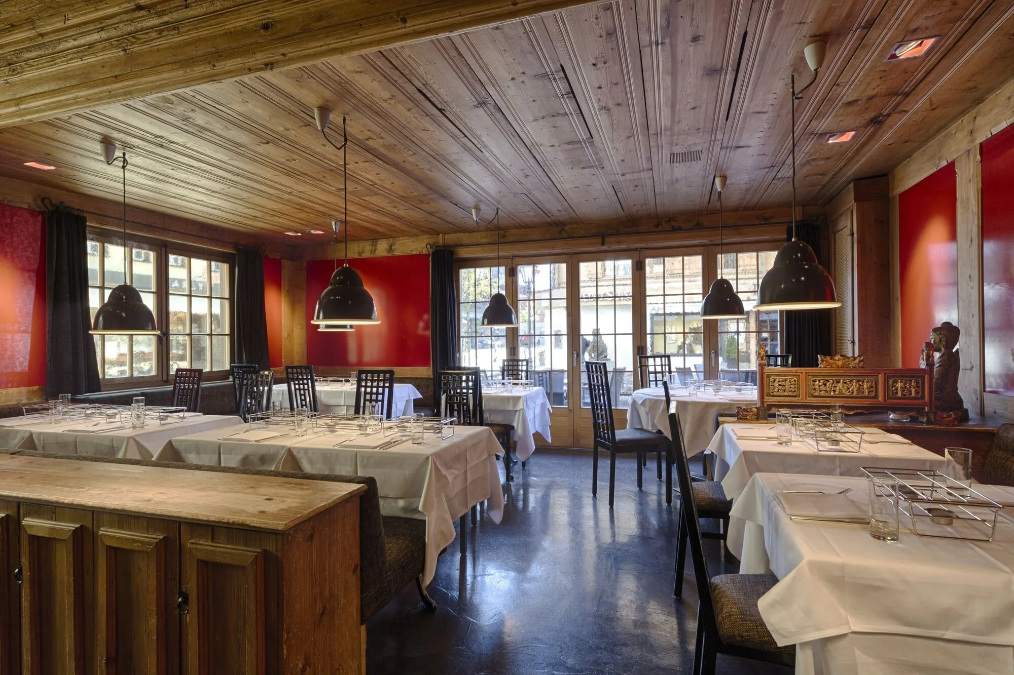 A restaurant with red walls