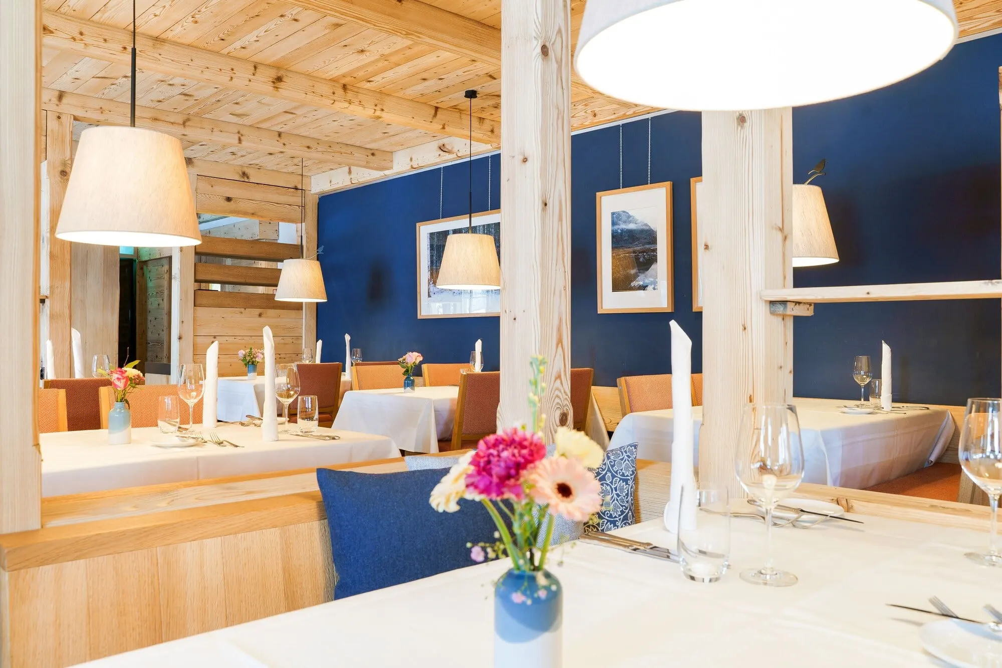 A restaurant under a wooden ceiling