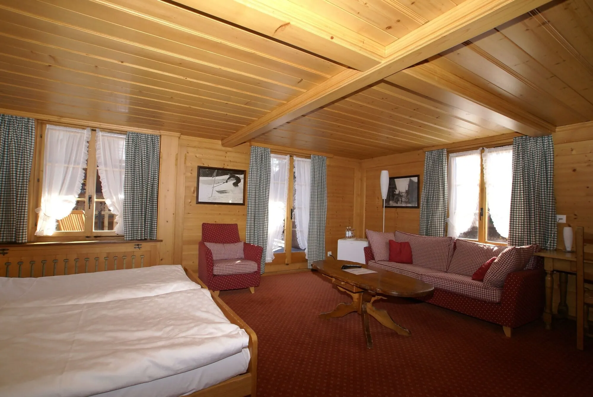 A pine-panelled room with a sofa