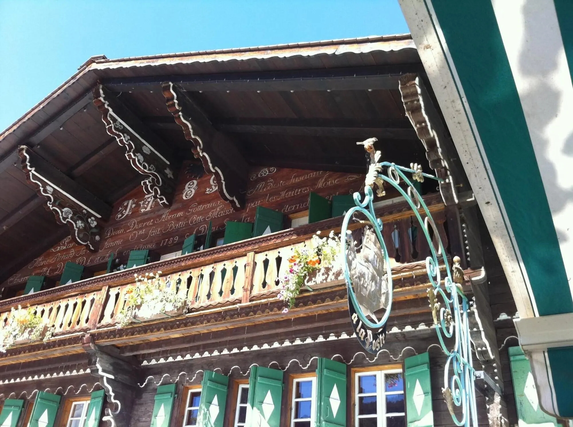 The carved façade and inn sign