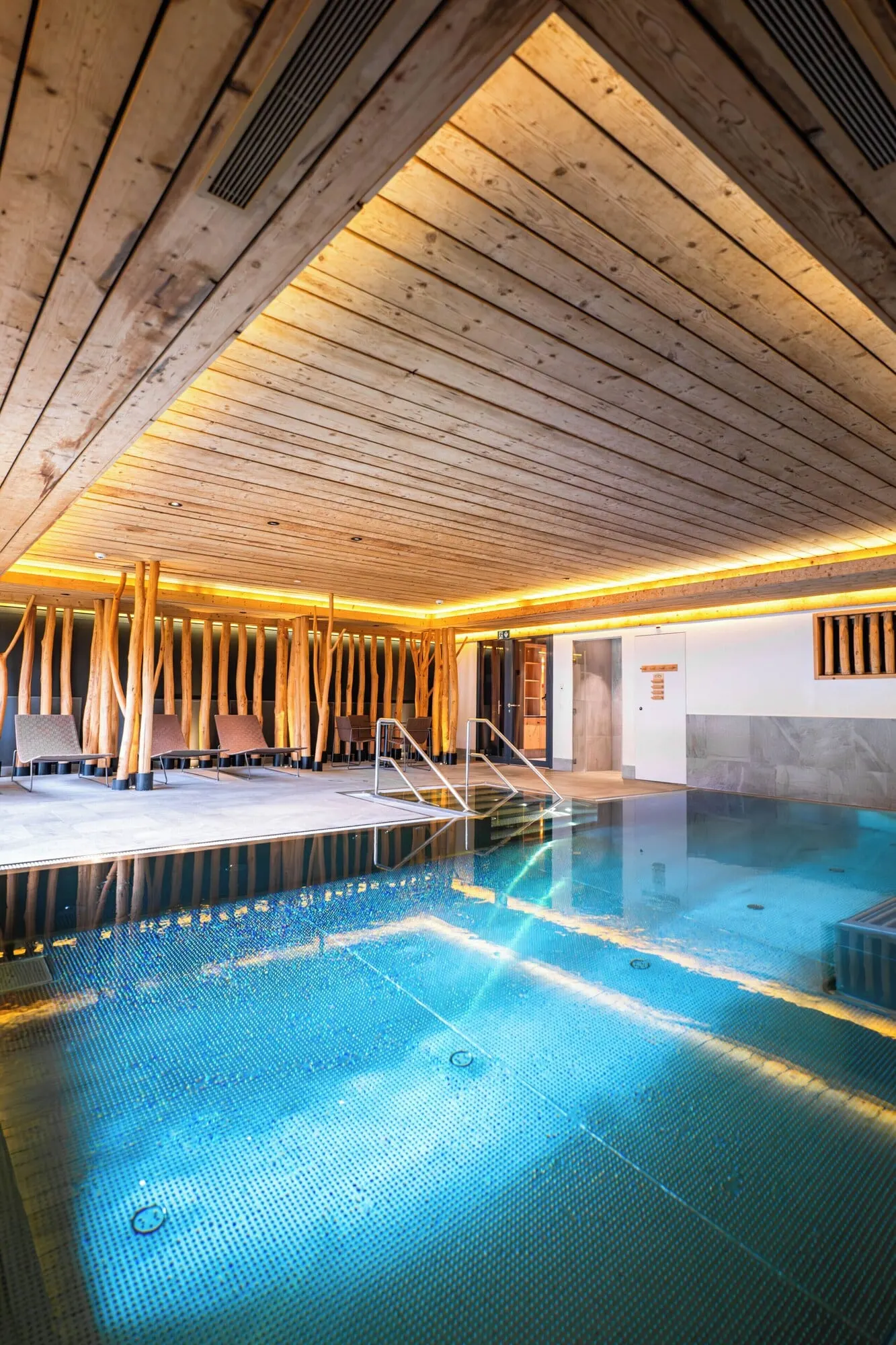 The indoor pool under wooden beams