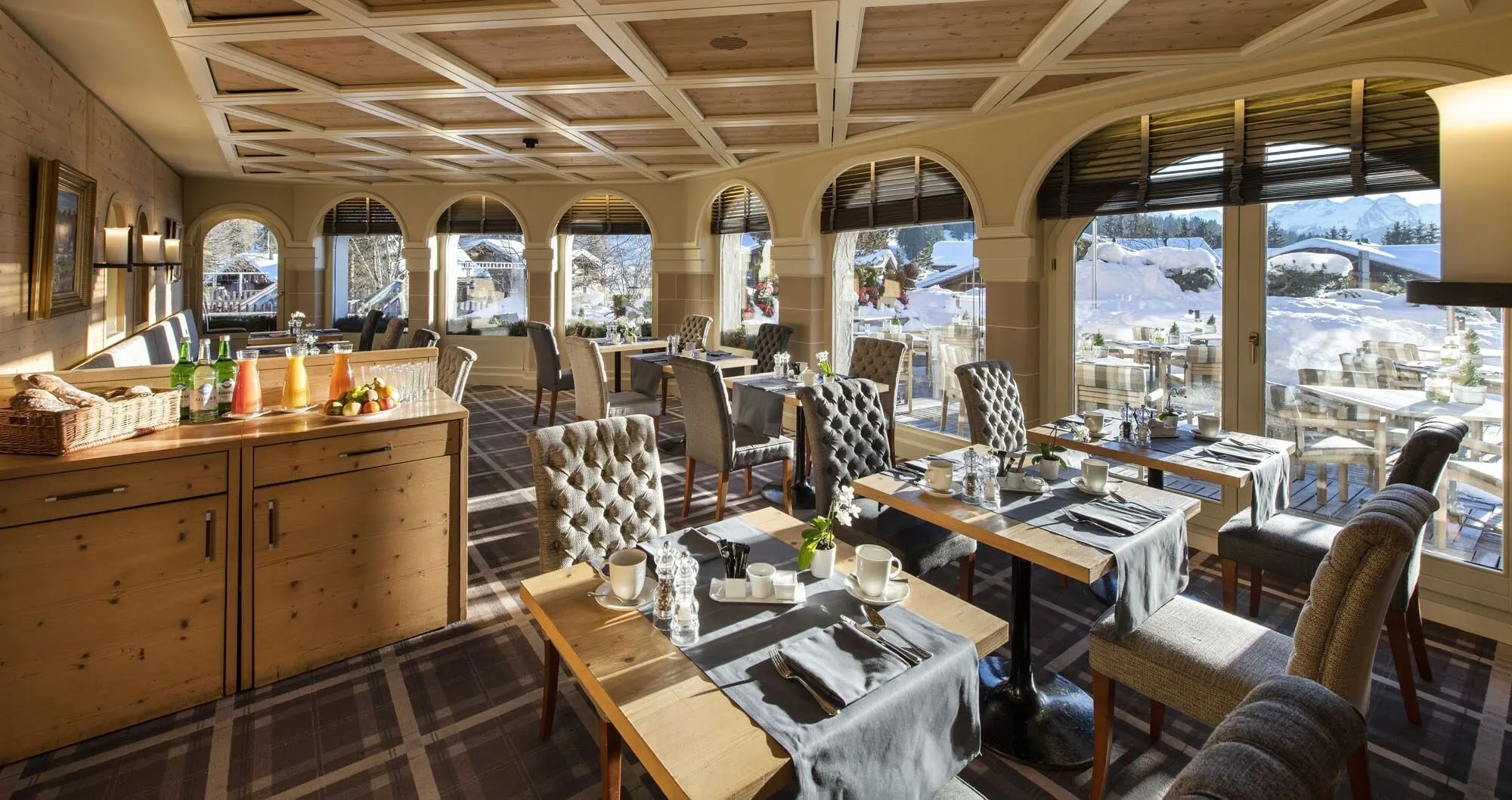 A restaurant with arched windows onto the snow